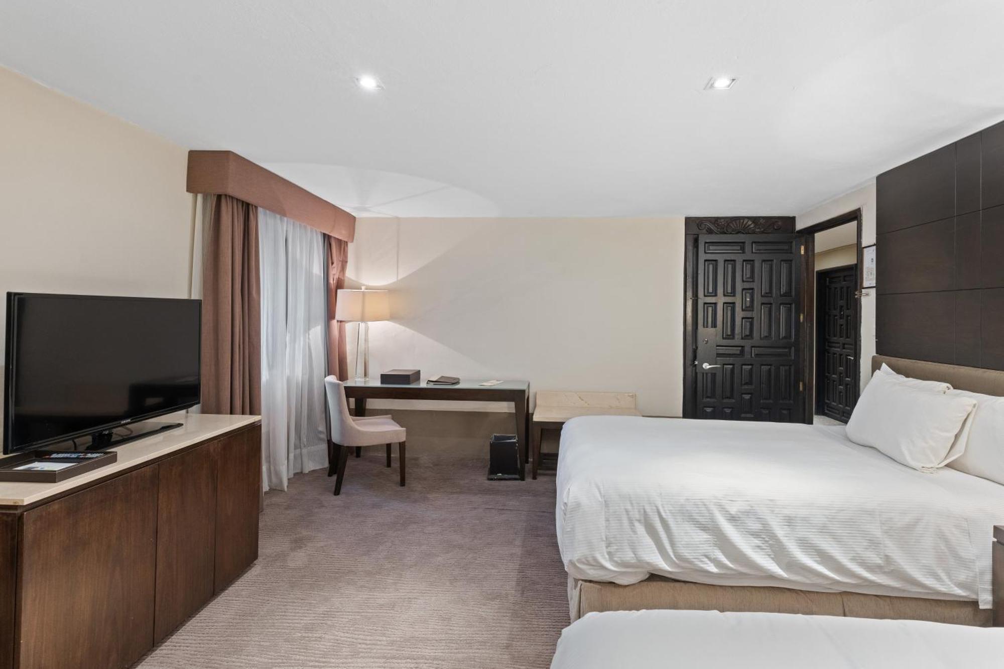 Quinta Real Puebla Hotel Exterior foto A guest room at the Hilton Garden Inn